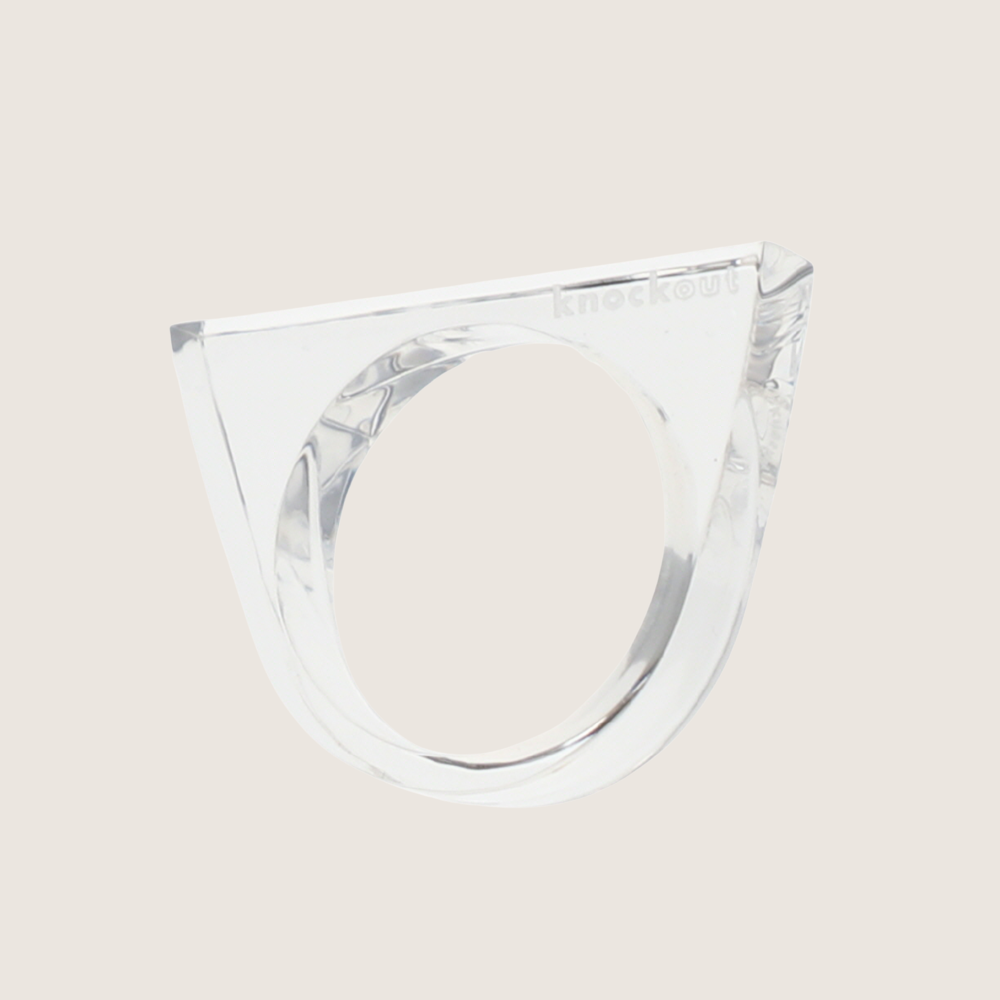 Clear lucite Knockout self-defense ring with a pointed top